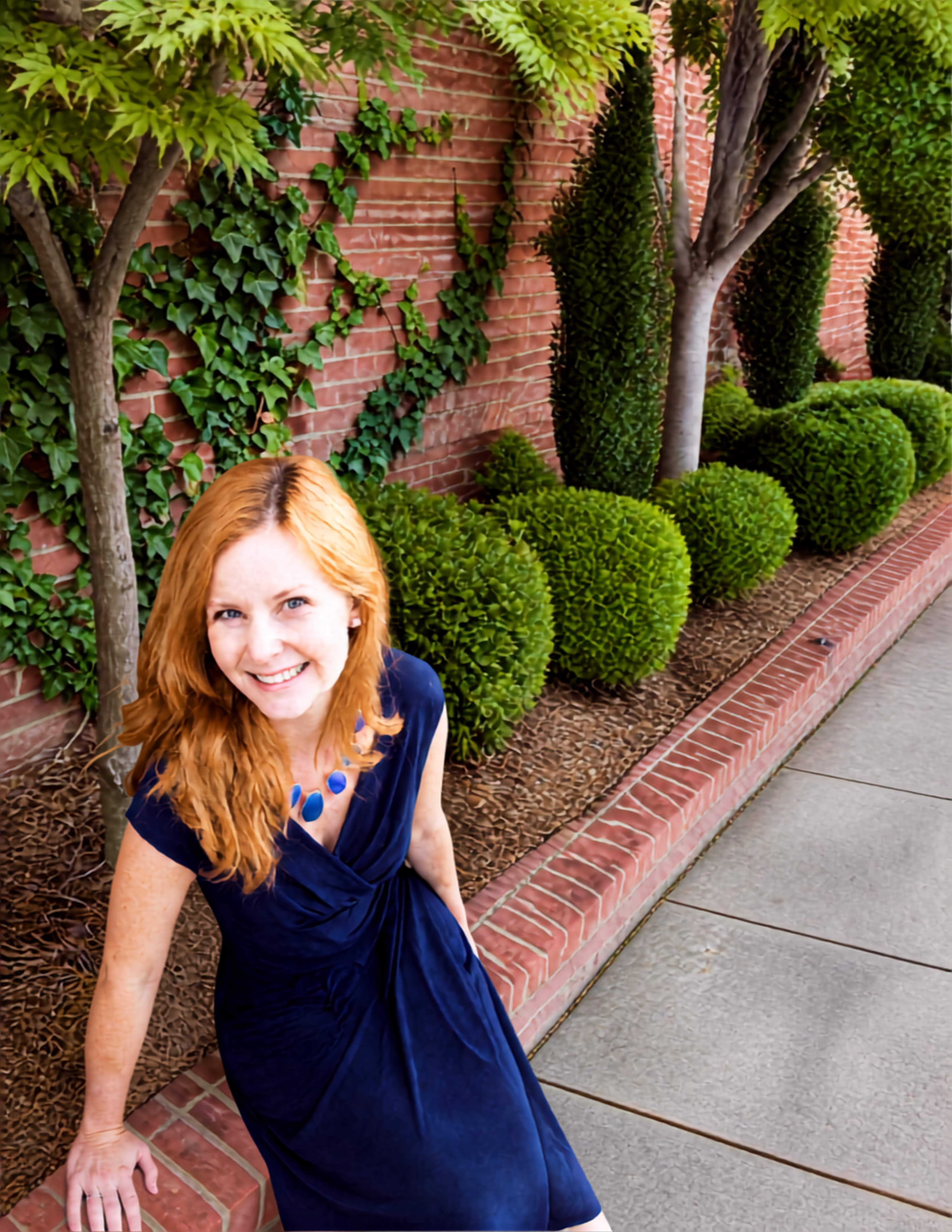 Meg McParland, B2B demand generation expert, on a tree-lined brick walkway